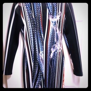 Women’s knee length dress with back zipper.